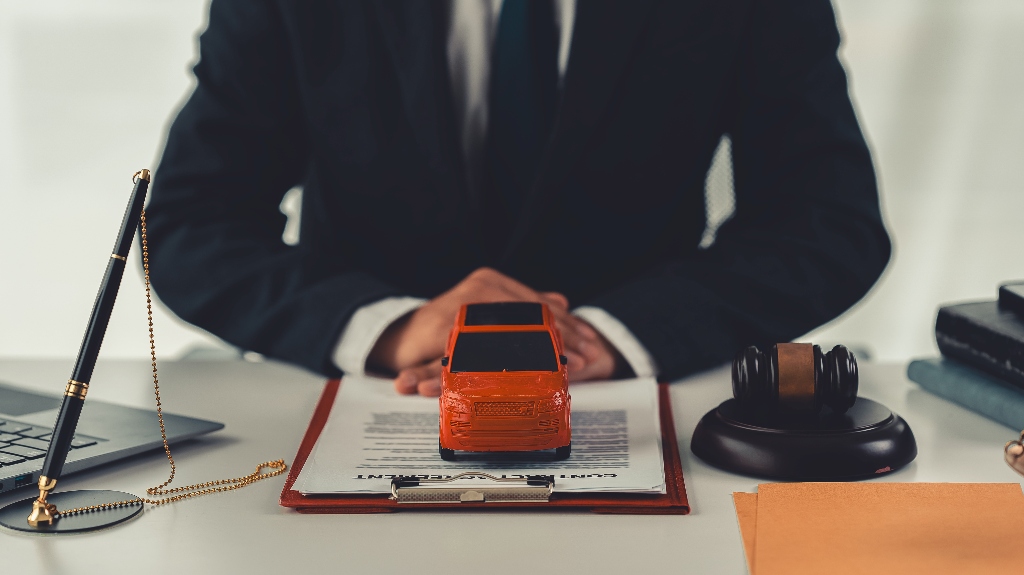 Lawyer, toy car and judge's gavel