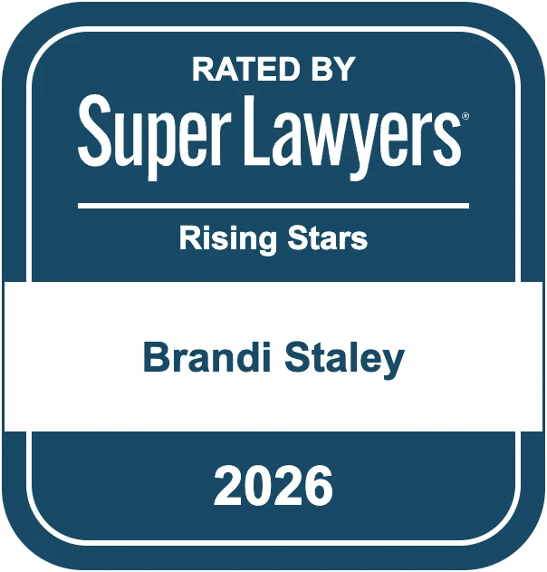 Blue and white badge reading "Rated by Super Lawyers Rising Stars Brandi Staley 2026.
