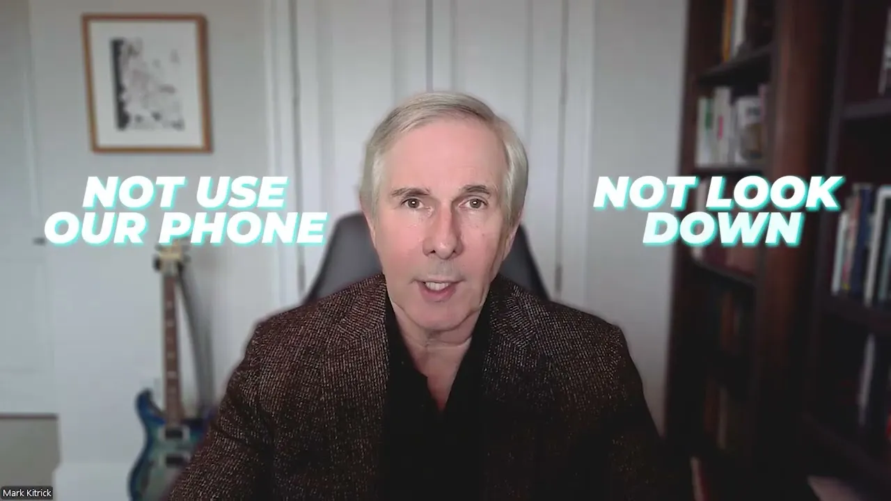 Middle-aged man with gray hair in a brown jacket speaking, with text "Not use our phone" and "Not look down" on either side.